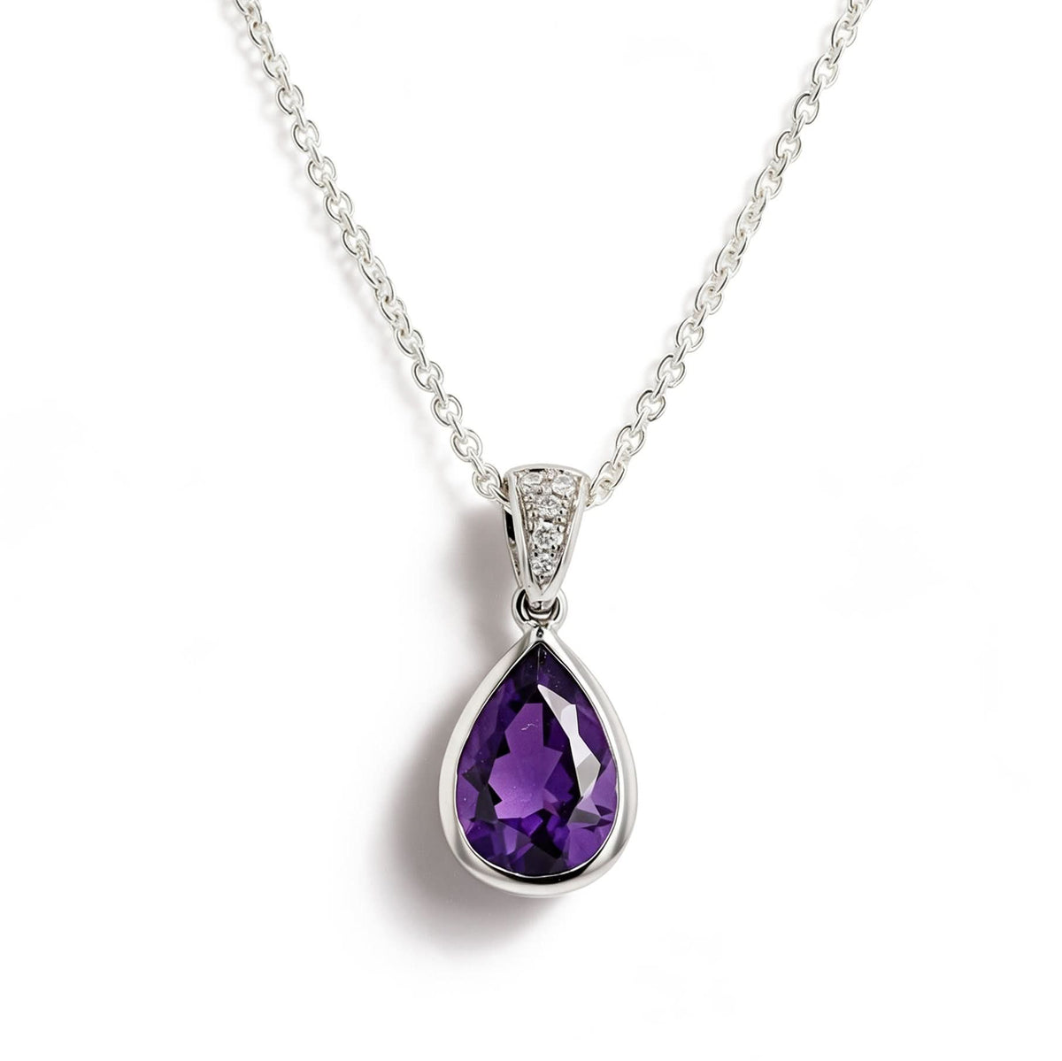 A white gold teardrop pendant necklace featuring a faceted purple gemstone, suspended from a delicate cable chain on a white background.