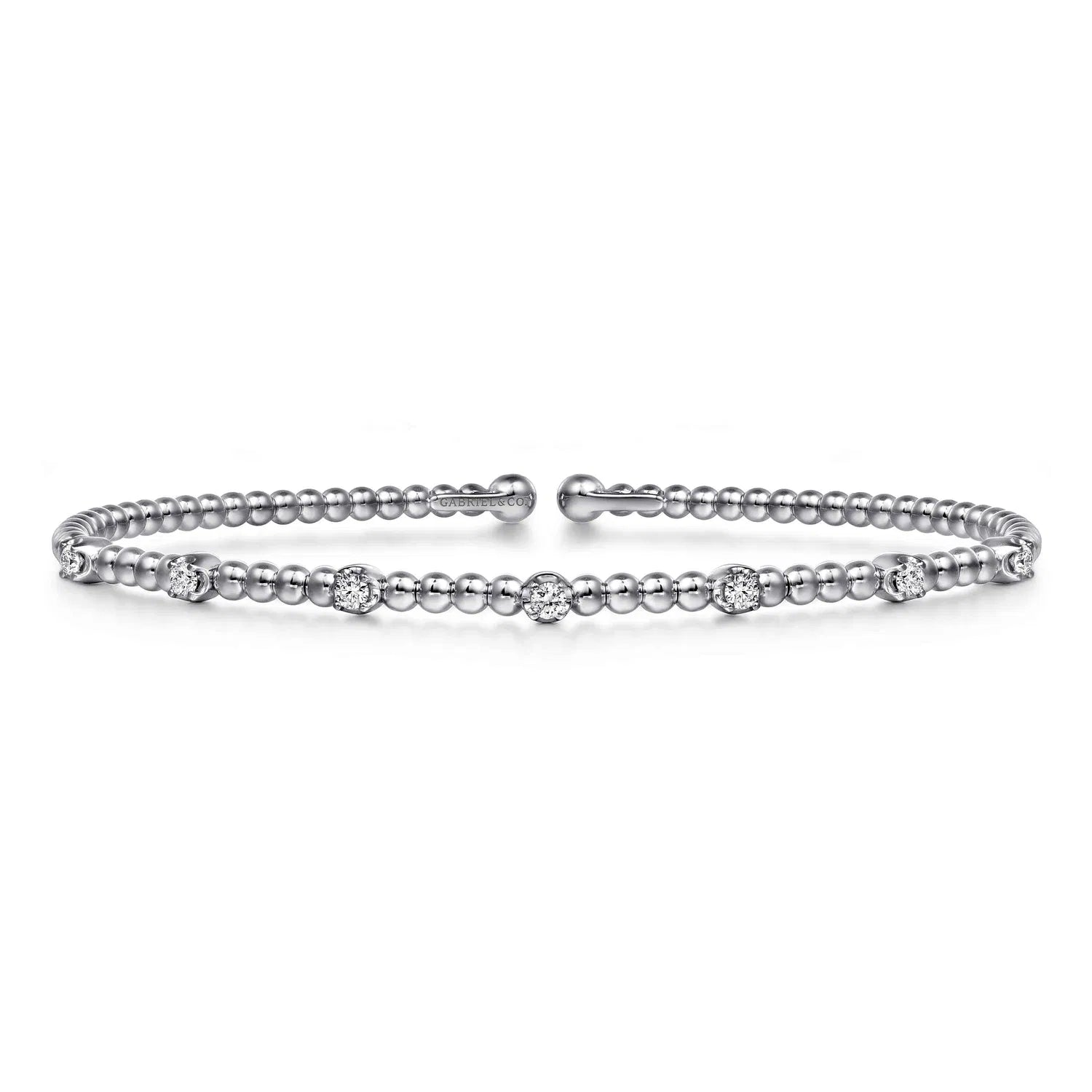 White gold bracelet with beads and diamonds on a white background