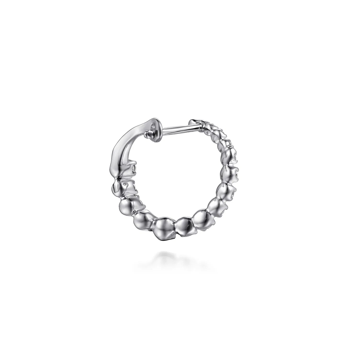 backside of white gold hoop earring on a white background
