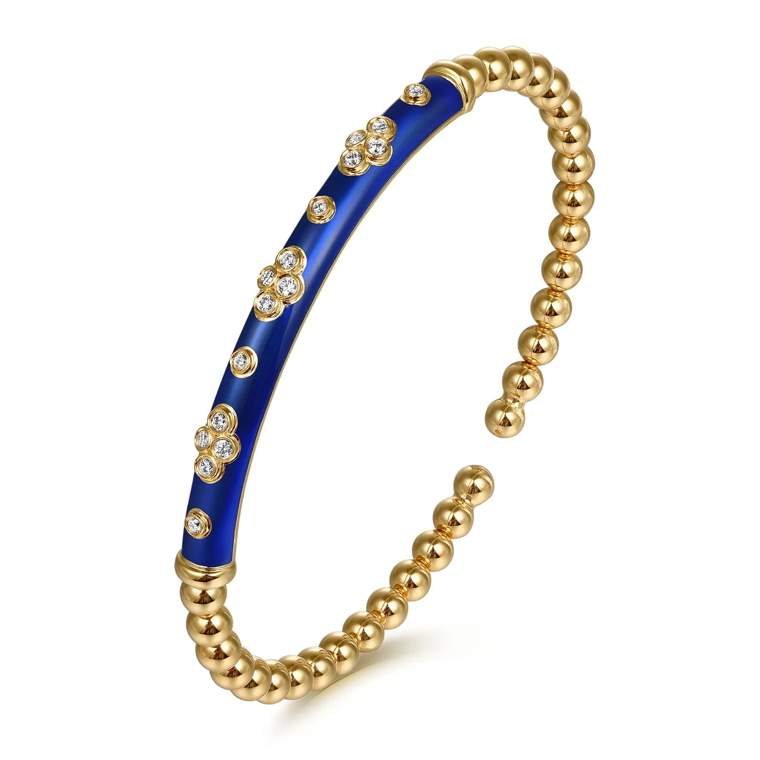 Gold bracelet with blue section and embedded stones on a white background angled