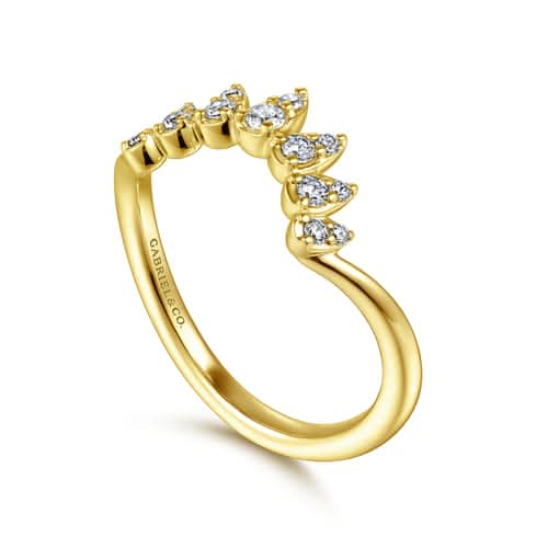 Gold ring with diamond accents on a white background angled view
