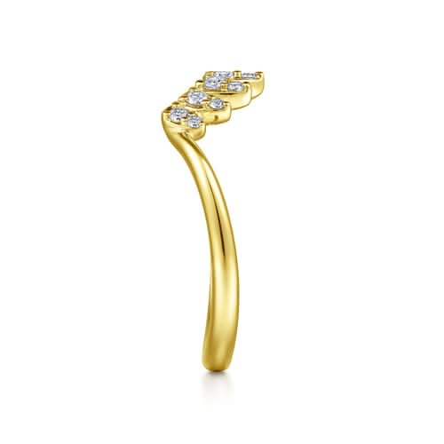Gold ring with diamond accents on a white background side profile