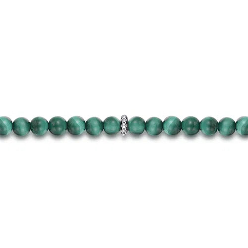 Green 4mm beaded necklace with a silver clasp on a white background Close up
