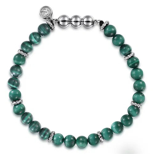 Green 6MM beaded bracelet with silver  accents on a white background