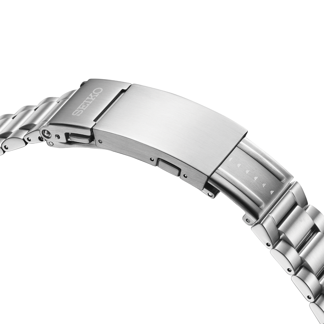 Close-up of a silver watch clasp with Seiko logo on a white background