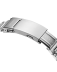 Close-up of a silver watch clasp with Seiko logo on a white background