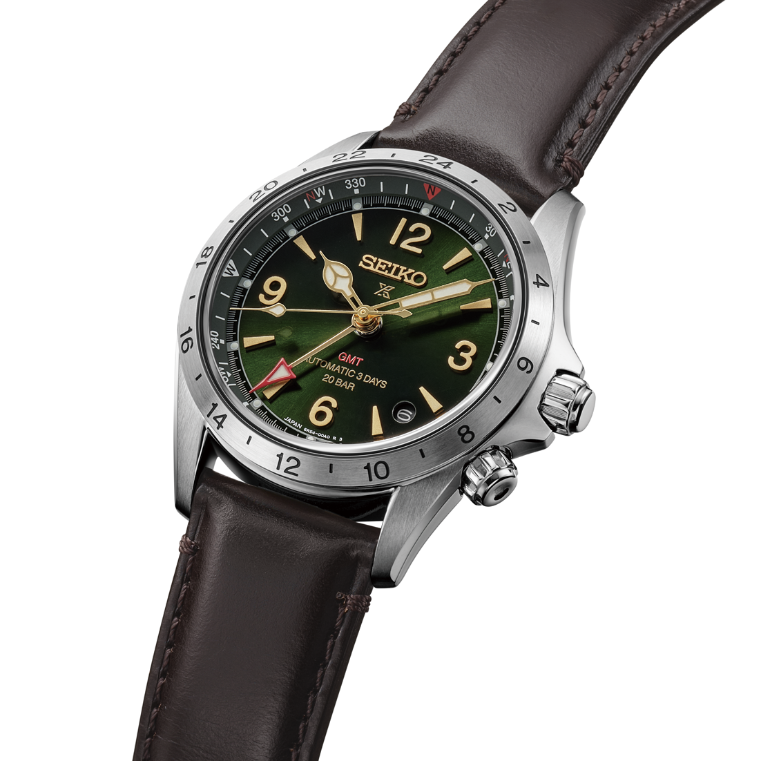 Seiko watch with green dial and brown leather strap on a white background- close up angled 