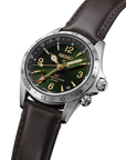 Seiko watch with green dial and brown leather strap on a white background- close up angled 