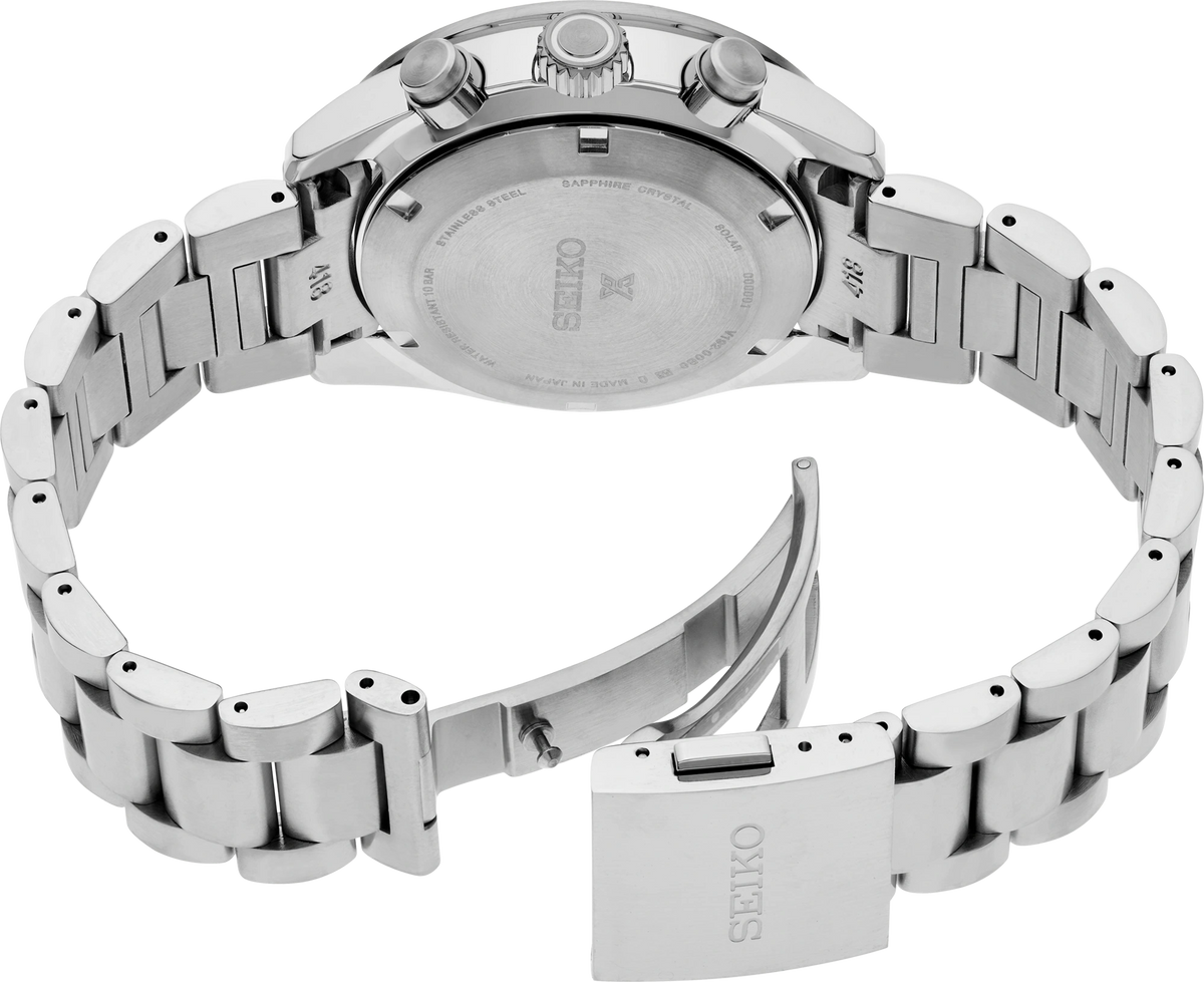 A Seiko stainless steel chronograph watch with a green dial and a black bezel featuring a green 24-hour marker ring, shown on a clean white background - back view