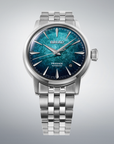 A Seiko Presage Automatic watch with a silver stainless steel case and link bracelet, featuring a textured blue and teal dial.