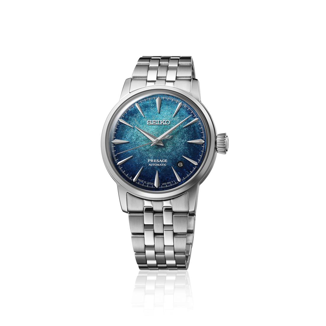 A Seiko Automatic watch with a silver stainless steel link bracelet and a textured blue dial, shown on a clean white background with a subtle reflection.