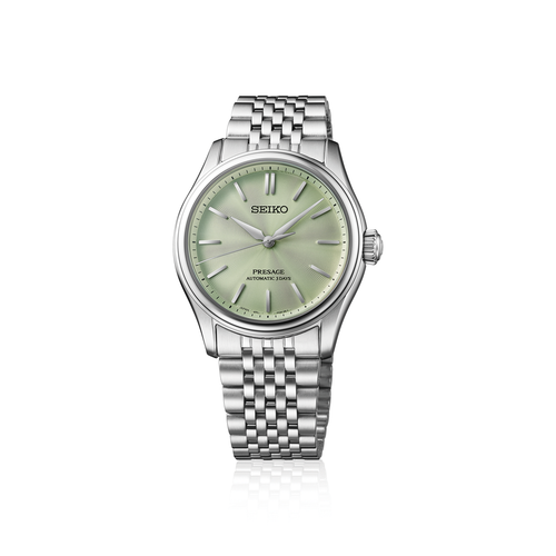 Seiko watch with silver bracelet and green dial on a white background