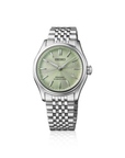 Seiko watch with silver bracelet and green dial on a white background