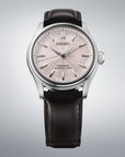Seiko watch with brown  leather strap  and pink dial on a gray background