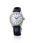 A front view of the Seiko Presage Classic Series 145th Anniversary watch HCC004J1 showcasing its compact 36mm stainless steel case, finely detailed textured bezel, raw-silk textured shironeri white dial with curved cobalt blue hands and applied indices, and a deep navy blue leather strap on a white background.