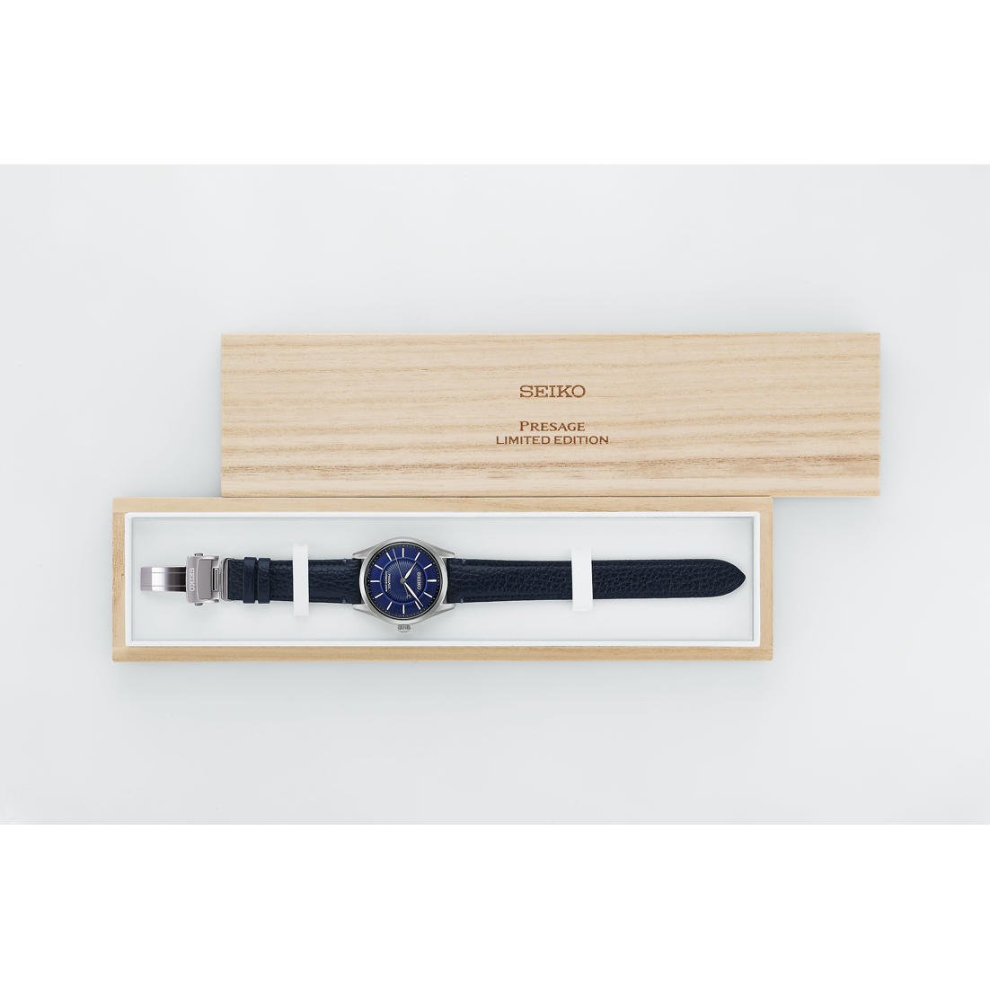 Seiko watch in a wooden box on a white background