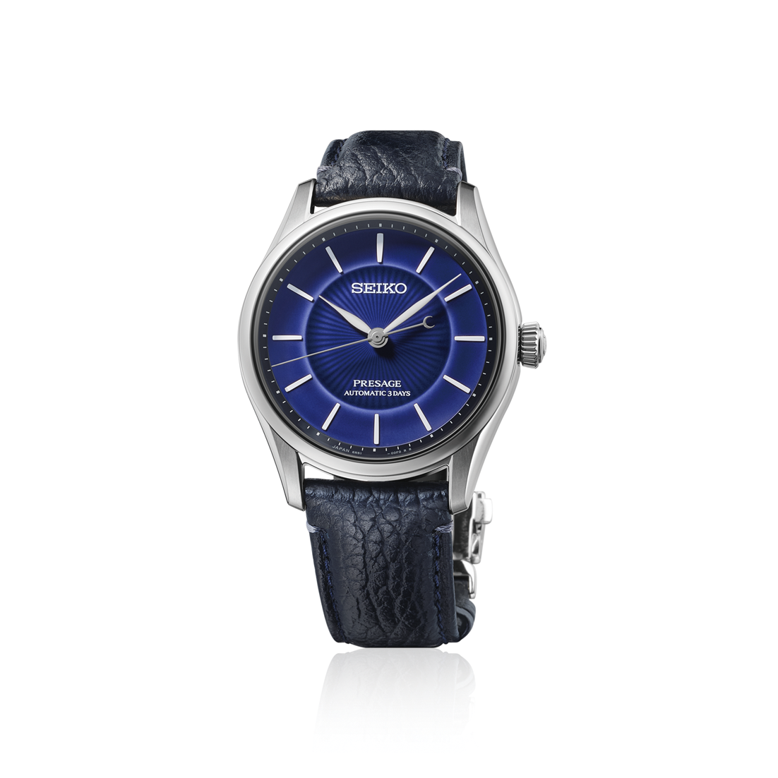 Seiko watch with blue dial and blue leather strap on a white background