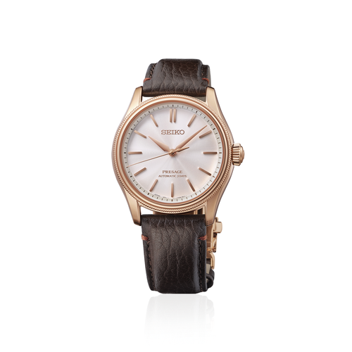 Seiko watch with brown leather strap on a white background