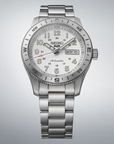 Silver Seiko watch with a detailed face on a gray background
