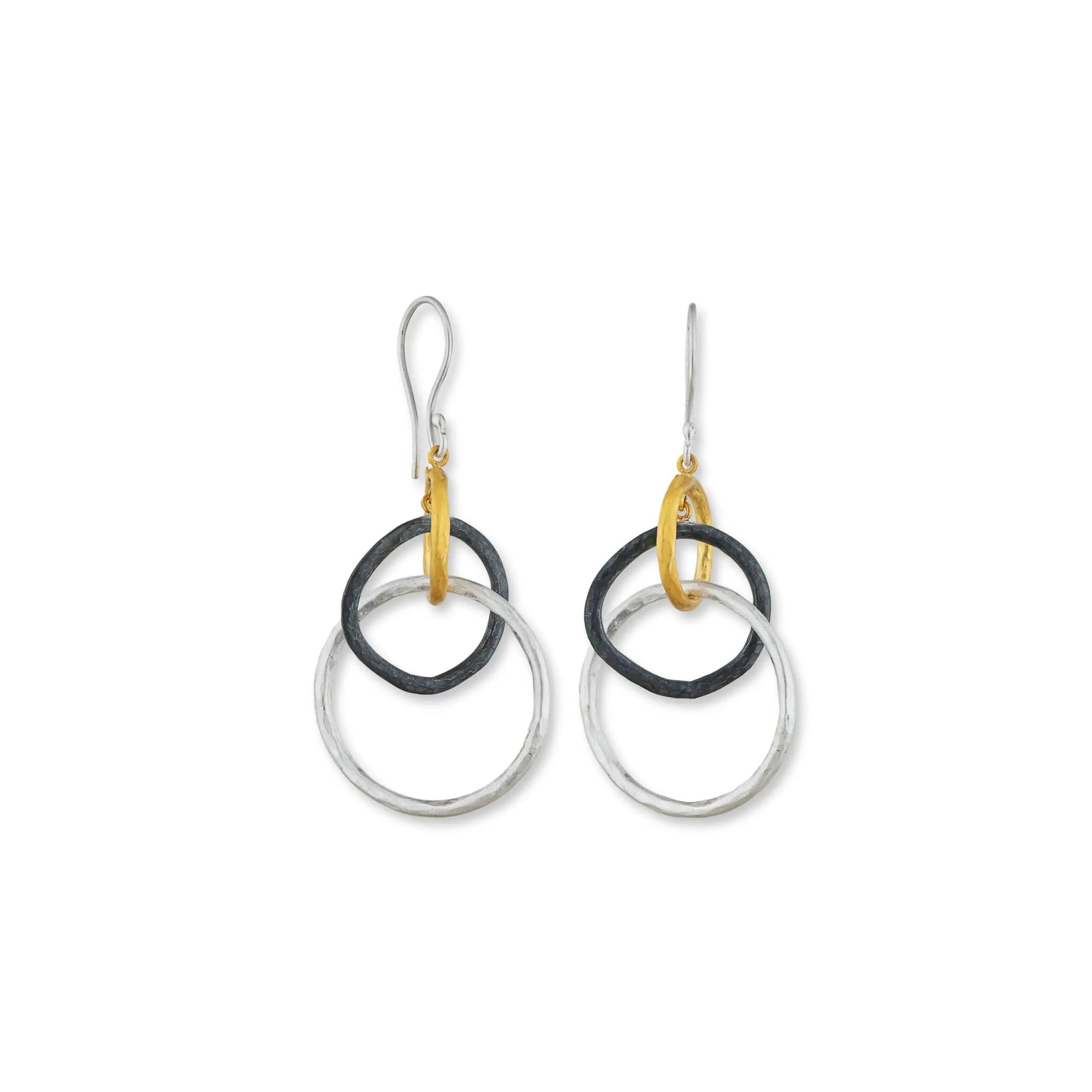 A pair of Lika Behar "Kelly" triple drop earrings featuring three interlocking, hand-hammered graduating circles in pure 24K yellow gold, dark oxidized silver, and matte sterling silver on silver earwires.
