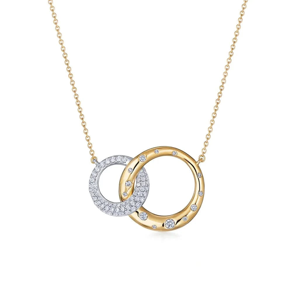 A front view of the Kwiat Cobblestone Interlocking Pendant Necklace (Style N-9837-0-DIA-18TT) featuring two intertwined circular rings—one in high-polish 18k yellow gold with burnished accent diamonds and one in 18k white gold covered in shimmering pavé diamonds—suspended from a fine gold chain on a crisp white background.