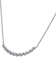 white gold necklace with small diamonds on a white background angled view