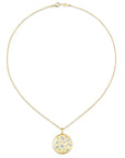 yellow necklace with embedded stones of different shapes on a white background