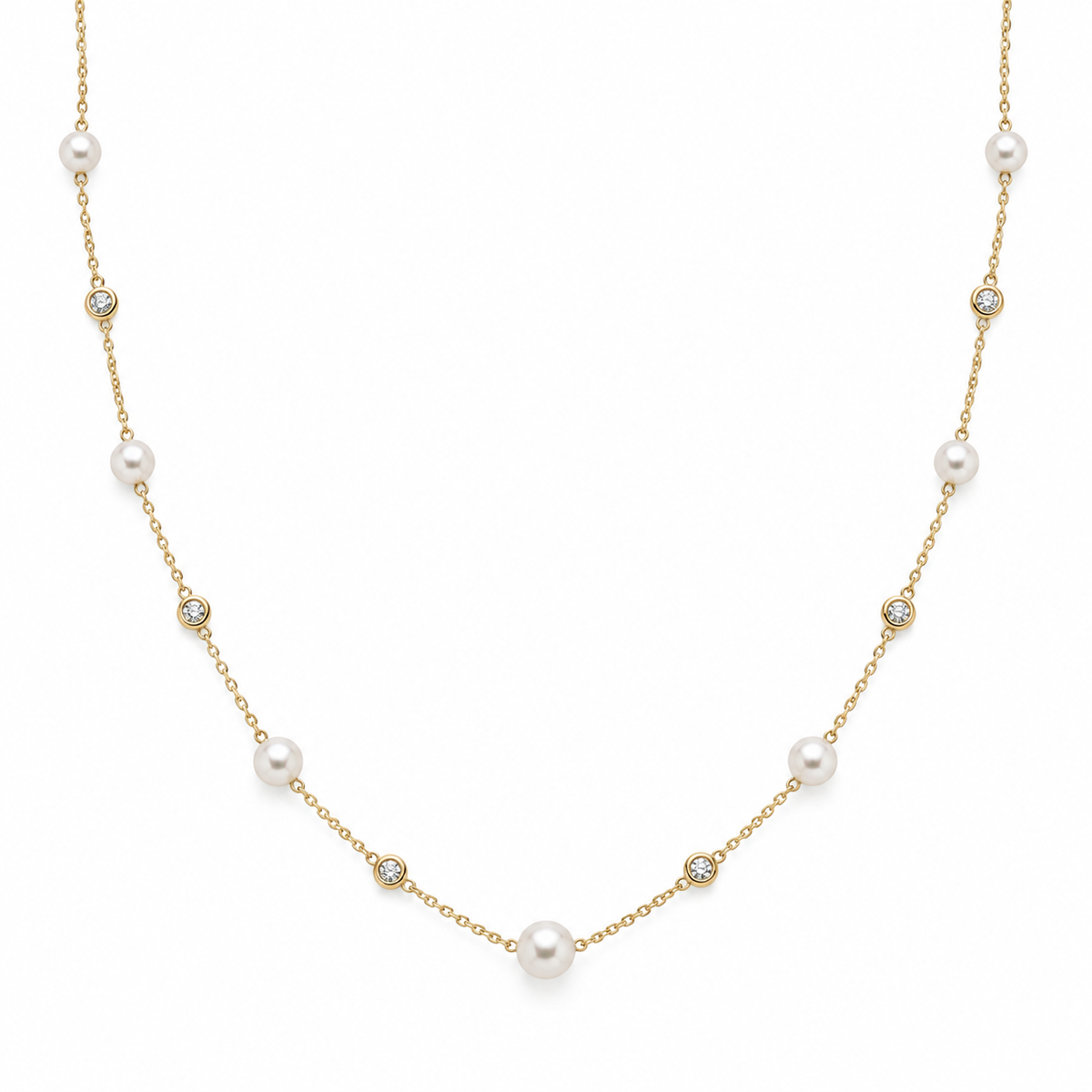 A delicate gold chain necklace featuring scattered white freshwater pearls and small bezel-set round clear stones, displayed on a clean white background.