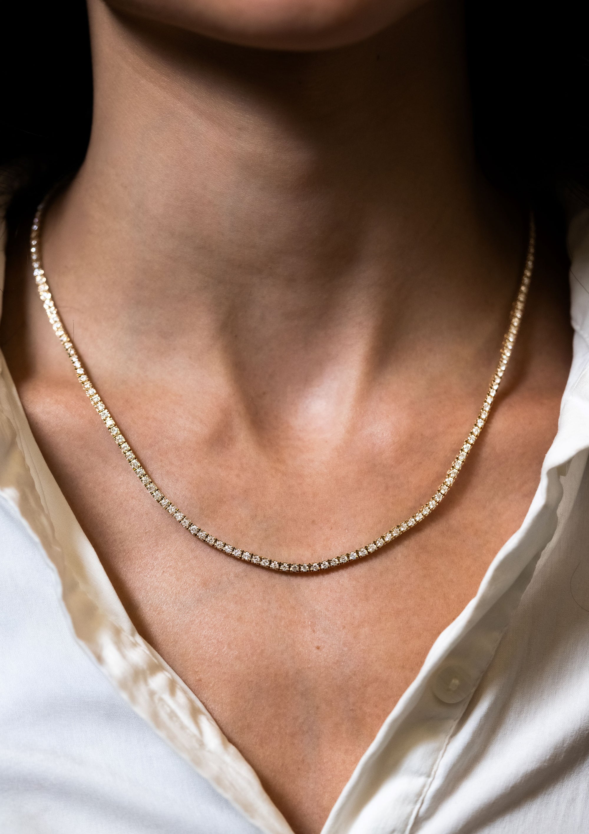 diamond line necklace on a neck 