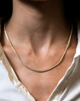 diamond line necklace on a neck 