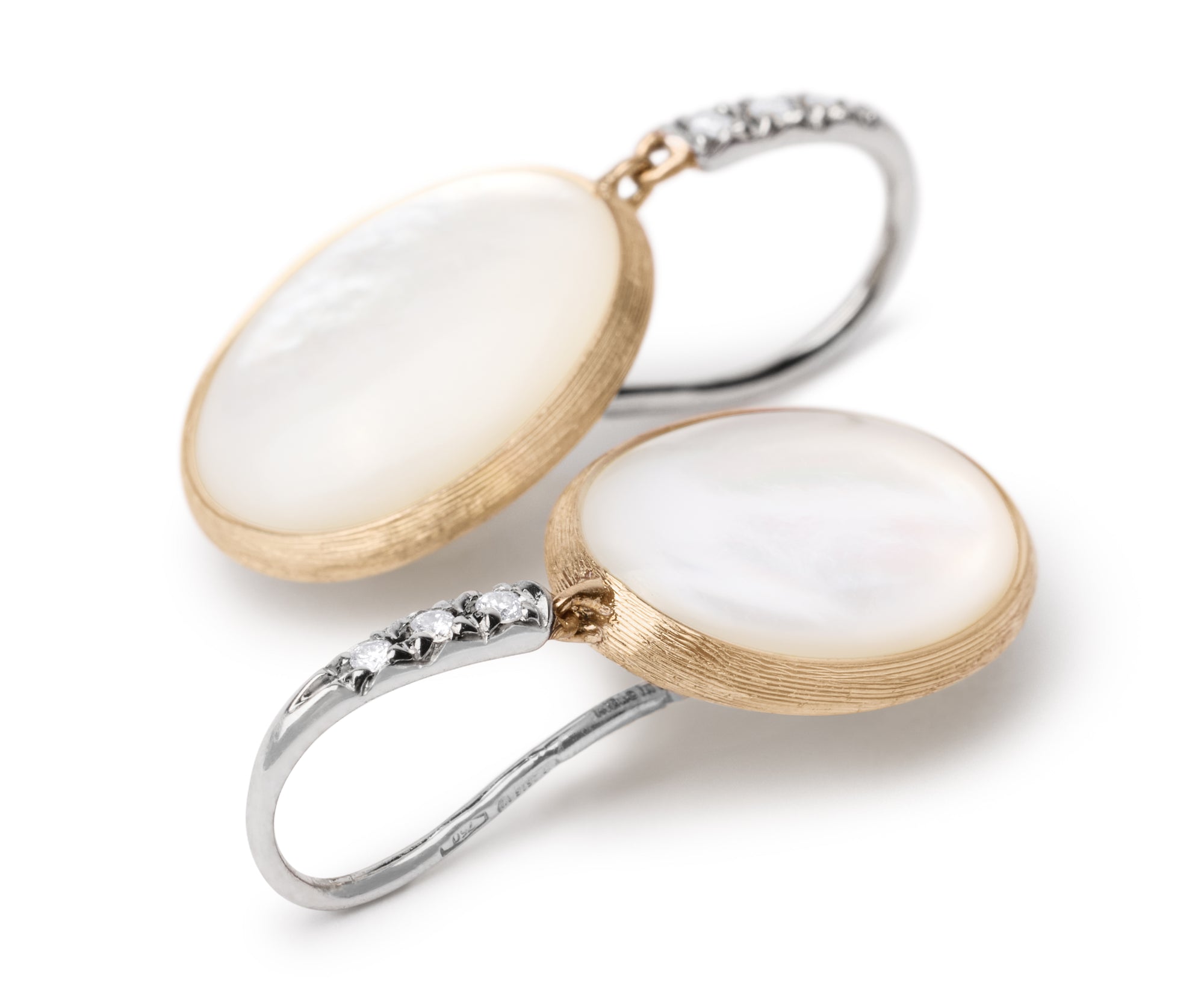 Pair of earrings with white mother of pearl stones and gold and white gold hooks on a white background