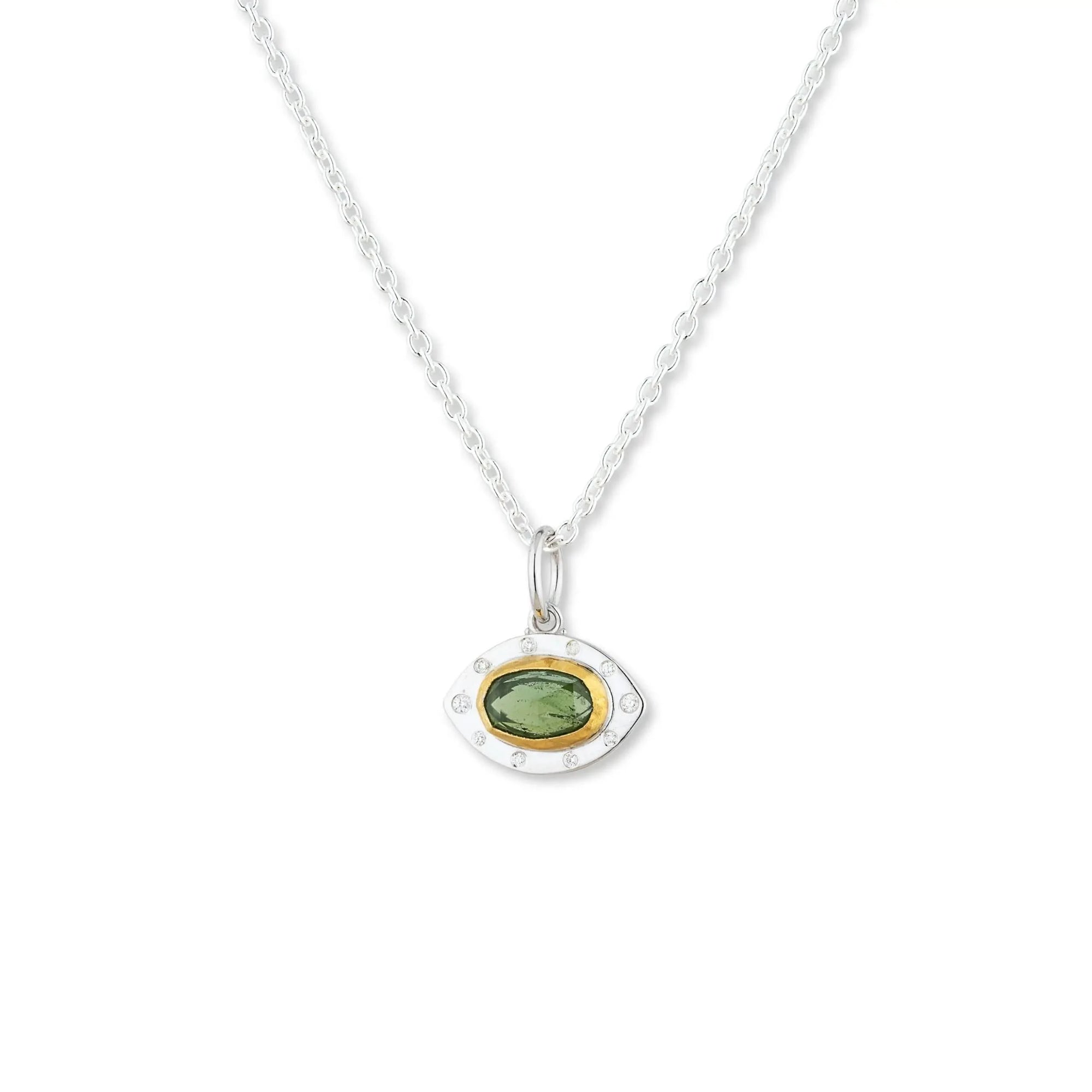A hand-wrought Lika Behar Penelope pendant featuring a rich oval-cut green tourmaline bezel-set in deep 24k yellow gold, surrounded by a textured matte sterling silver border accented with small white diamonds.