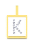 A square yellow gold pendant with a top loop, featuring a white center inlaid with a row of sparkling clear gemstones arranged to form the letter 'K'.