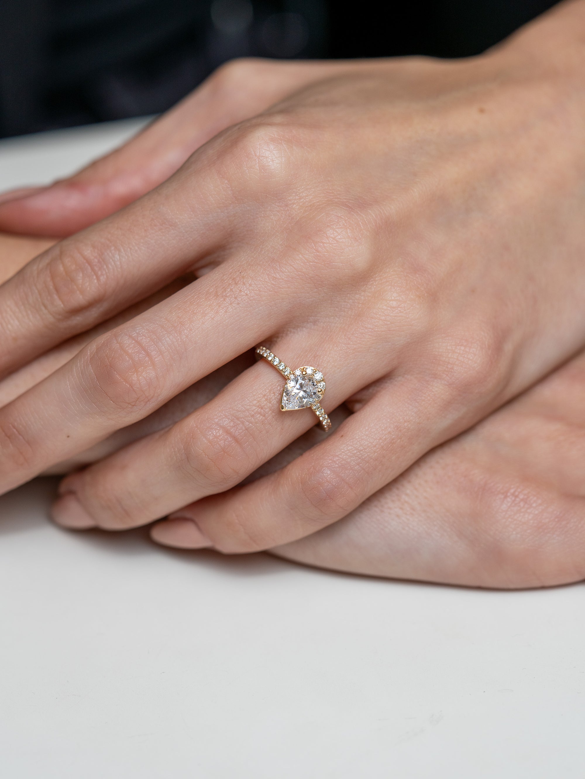 Pear-Cut Graduating Halo Engagement Ring - Skeie's Jewelers