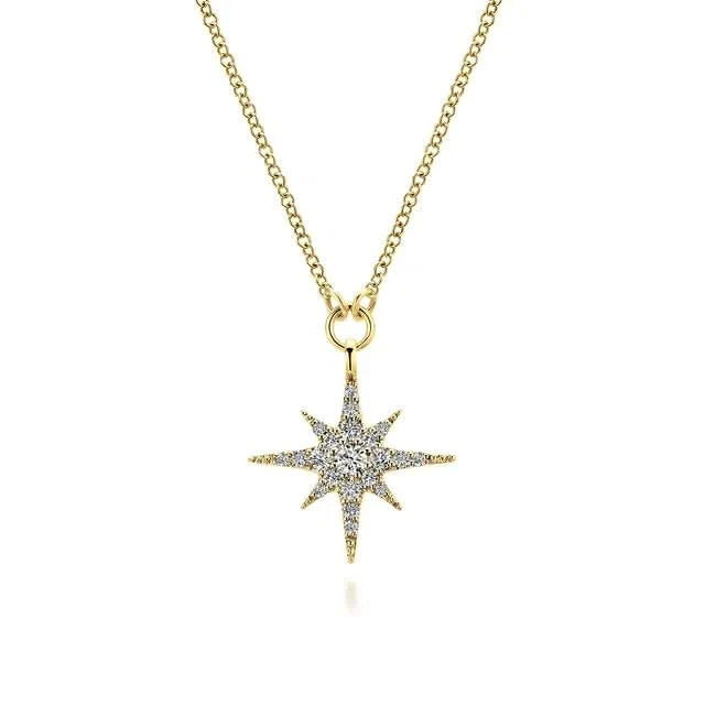 Gold necklace with a star-shaped pendant on a white background