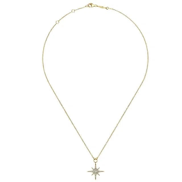 Gold necklace with a star-shaped pendant on a white background with chain