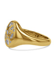 Gold ring with diamond stones on a white background side view