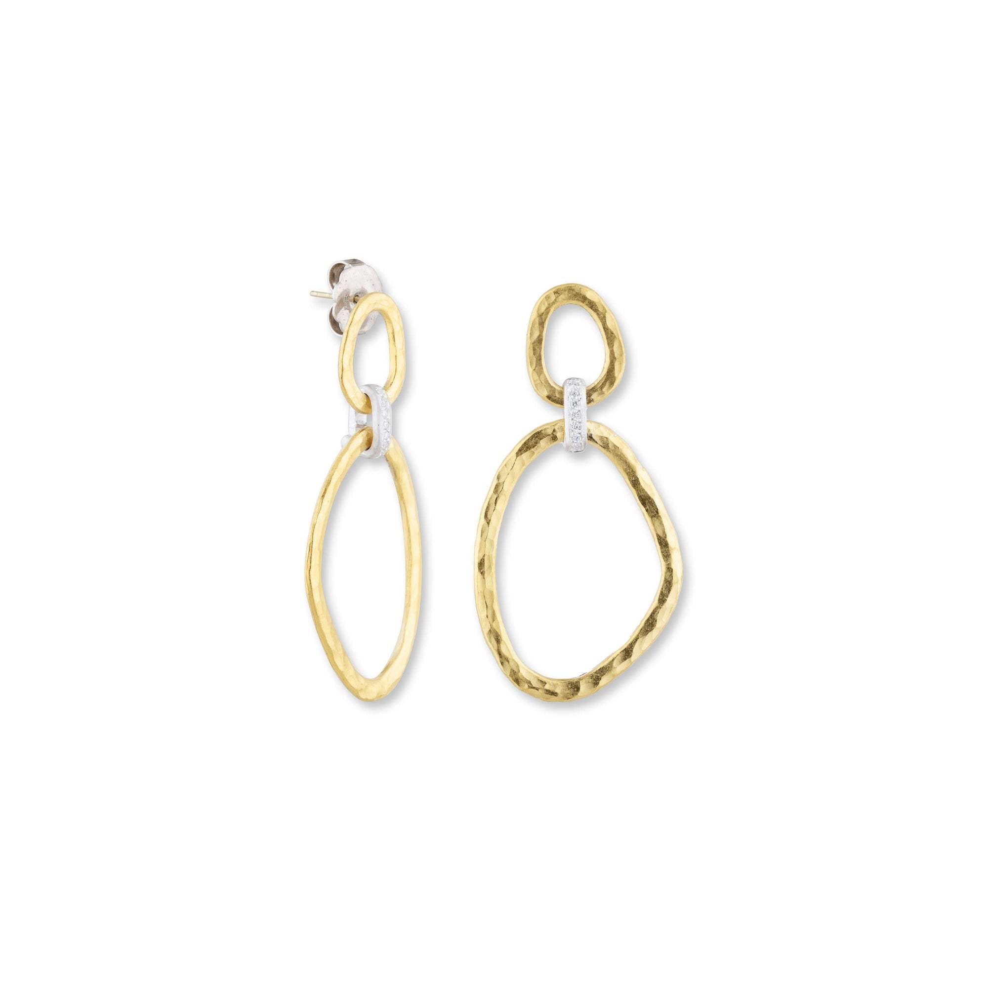 yellow gold dangle earrings with silver and embedded diamonds on a whit background