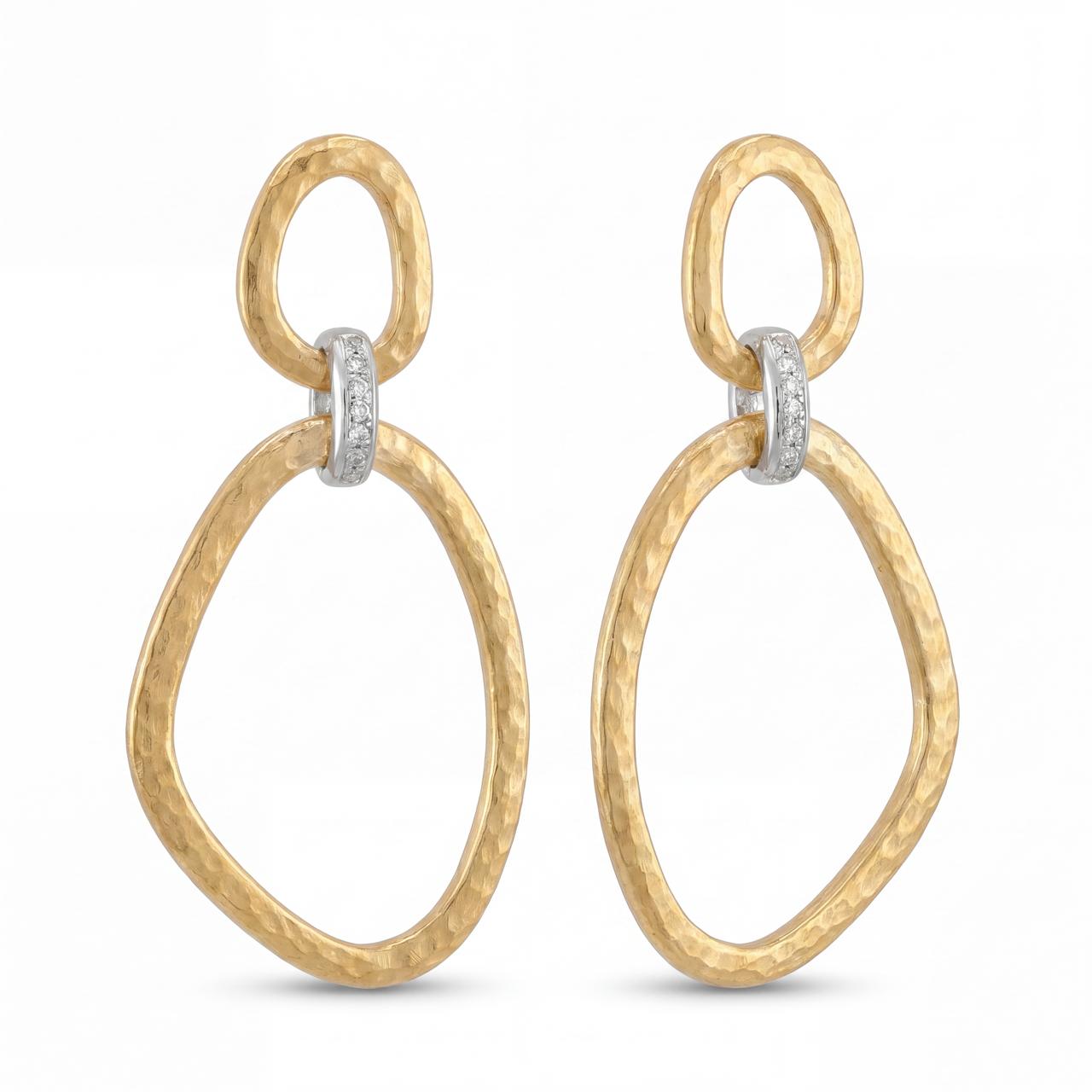 Gold hoop earrings with diamond accents on a white background