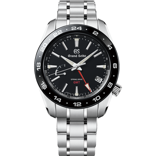 Grand Seiko watch with black dial and silver bracelet on a white background