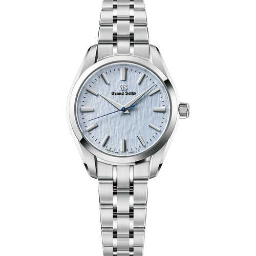 A Grand Seiko Heritage Collection SBGX361 "Skyflake" quartz watch showcasing a 33mm stainless steel case and matching three-row bracelet, highlighting its slim 9.1mm profile and pale blue wind-swept snow textured dial accented by diamond-cut dauphine hands.