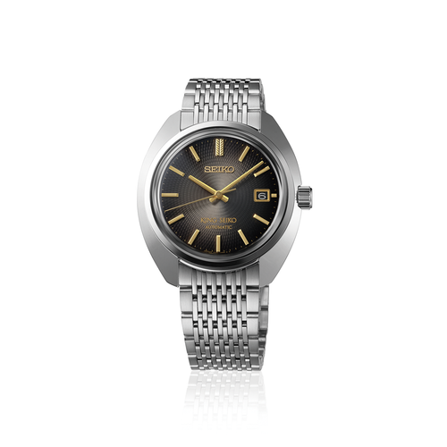 A King Seiko SJE121 limited edition automatic watch, showcasing its 38.6mm ultra-slim stainless steel case, textured charcoal black dial with multifaceted silver indices, and a vintage-style seven-link metal bracelet.