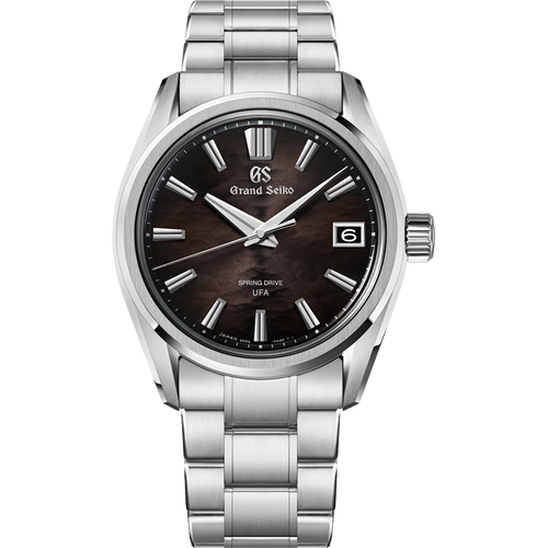 A Grand Seiko wristwatch with a polished stainless steel link bracelet and a dark wood-grain dial, shown against a solid white background.