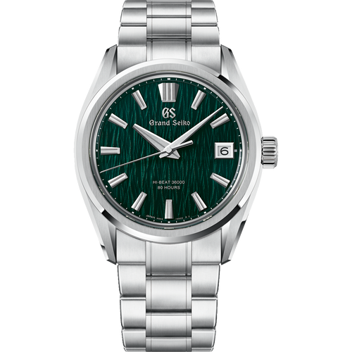 A Grand Seiko wristwatch with a polished silver stainless steel case and integrated link bracelet, featuring a textured dark green dial with silver-tone indices and hands.