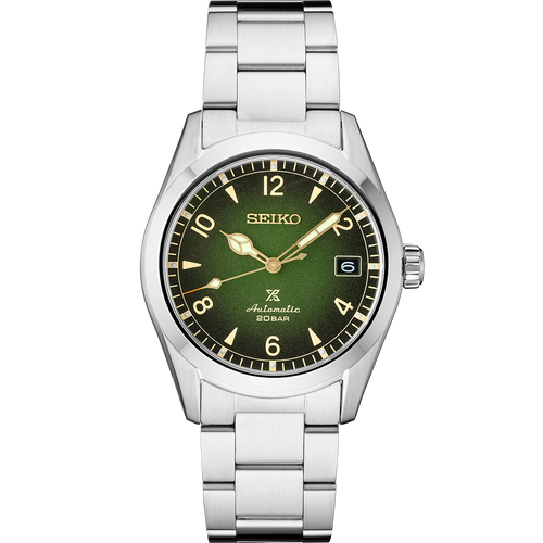 Seiko watch with green dial and silver metal strap on a white background