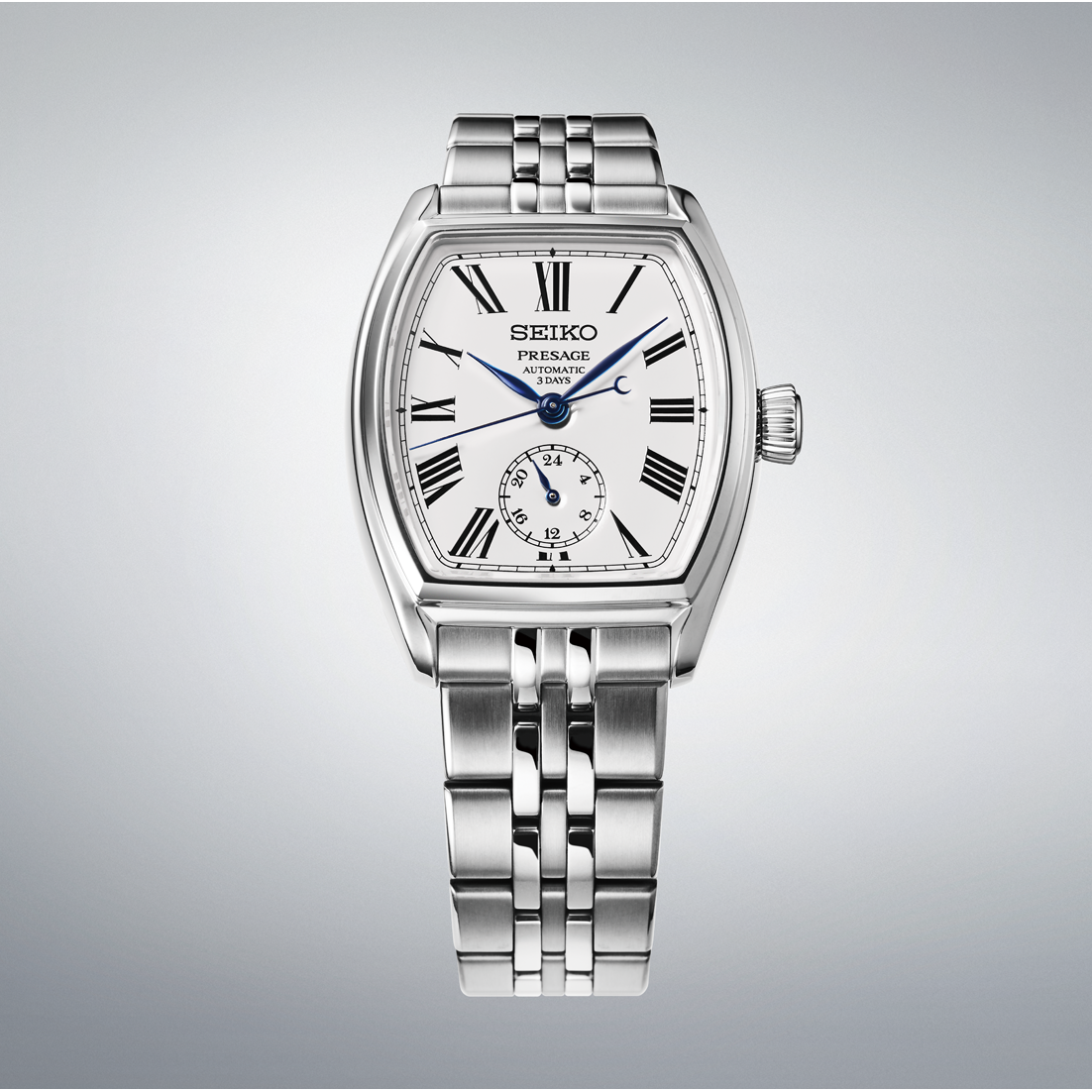 Silver Seiko watch with a white face on a gray background