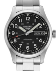 A Seiko automatic wristwatch with a stainless steel link bracelet, featuring a black dial with white Arabic numerals, silver-tone hands, and a day-and-date window.