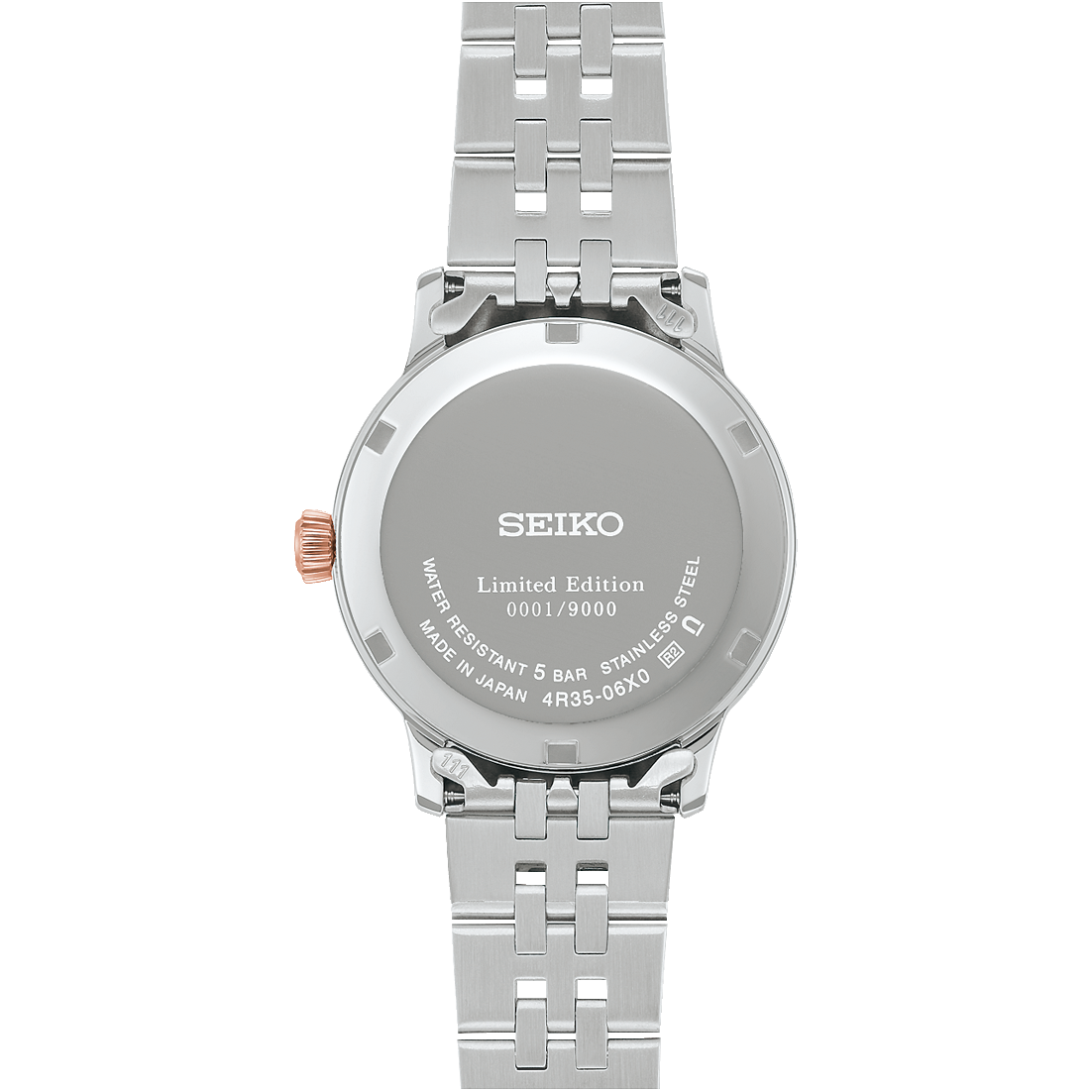 back of Seiko watch with silver metal strap on a white background