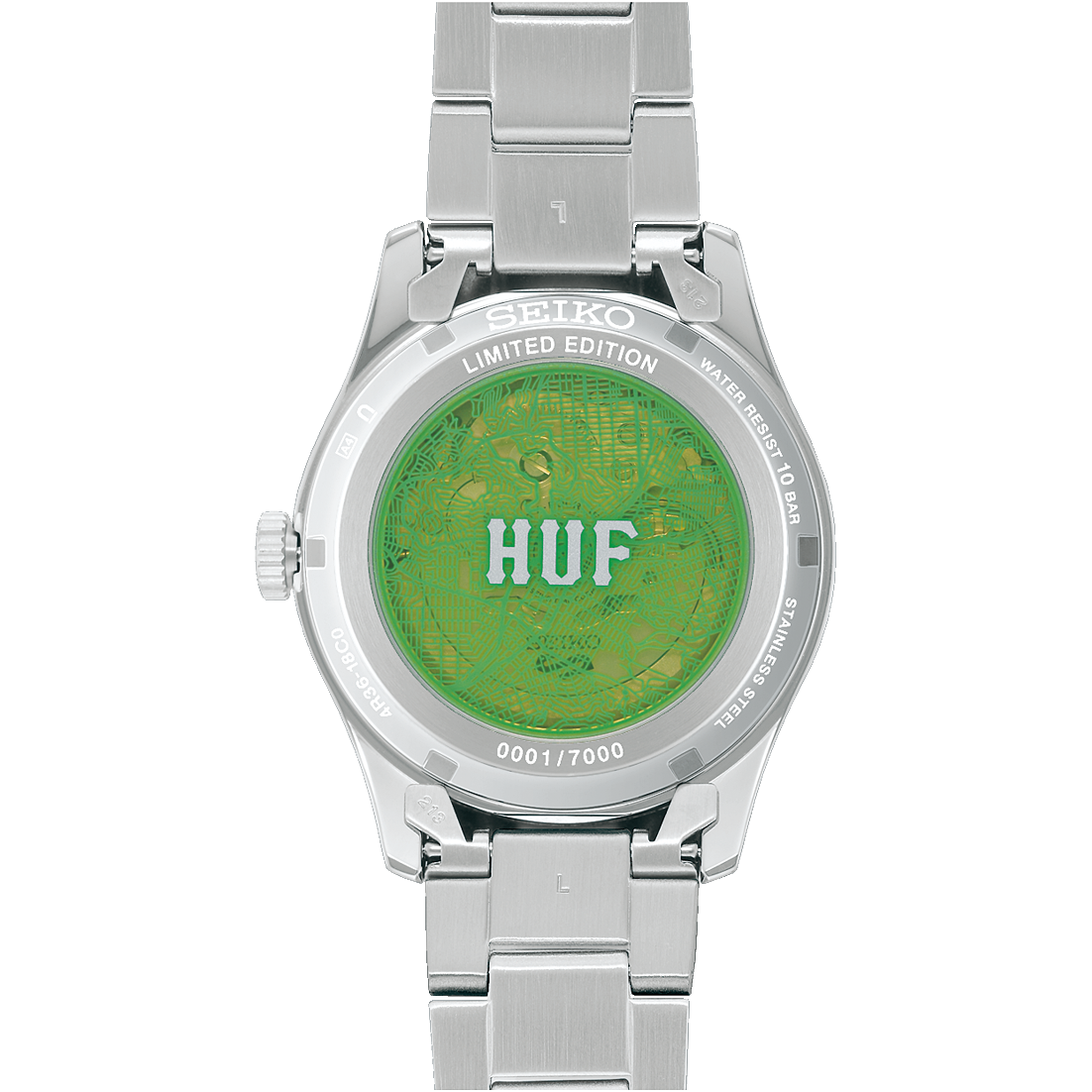 Back of Silver Seiko watch with green back and 'HUF' branding on a white background