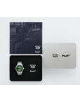 Seiko and HUF branded watch, cloth, and card on a white background